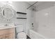 Bathroom boasts a bathtub with shower, decorative mirror, and stylish shelving at 3741 Block House Way # 736, Myrtle Beach, SC 29577