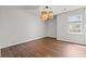 Dining room featuring a modern light fixture, wood flooring, and a window at 3741 Block House Way # 736, Myrtle Beach, SC 29577