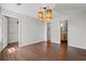 Dining room opens to other rooms and includes a modern light fixture and wood flooring at 3741 Block House Way # 736, Myrtle Beach, SC 29577