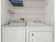 Laundry area includes a white washer and dryer, with shelving for storage of supplies at 3741 Block House Way # 736, Myrtle Beach, SC 29577