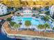 Aerial view of the community pool, showcasing lounge areas, landscaping, and surrounding amenities at 3741 Block House Way # 736, Myrtle Beach, SC 29577
