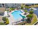 Community pool area with lounge chairs, shade umbrellas, and landscaped surroundings at 3741 Block House Way # 736, Myrtle Beach, SC 29577