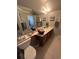Bathroom boasting ample vanity space, tile floors, and a bright, inviting atmosphere at 4396 Baldwin Ave. # C-24, Little River, SC 29566
