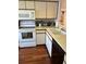 Functional kitchen featuring modern appliances and wooden flooring at 4396 Baldwin Ave. # C-24, Little River, SC 29566