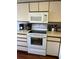 Bright kitchen featuring white appliances and ample cabinet space at 4396 Baldwin Ave. # C-24, Little River, SC 29566