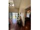 Open living room with hardwood floors, fan, and sliding glass door to deck overlooking yard at 4396 Baldwin Ave. # C-24, Little River, SC 29566
