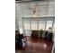 Bright sun room features lots of windows, white ceiling, and hardwood flooring at 4396 Baldwin Ave. # C-24, Little River, SC 29566