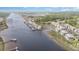 Aerial view of waterfront condos with boat docks along the waterway at 4409 Eastport Blvd. # E2, Little River, SC 29566
