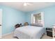 Bedroom with ceiling fan, neutral walls and natural light at 4409 Eastport Blvd. # E2, Little River, SC 29566