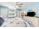 Bedroom with blue walls, ceiling fan, and window seat overlooking the yard at 4409 Eastport Blvd. # E2, Little River, SC 29566
