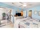 Airy bedroom with light blue walls and sliding glass doors to an outdoor living area at 4409 Eastport Blvd. # E2, Little River, SC 29566