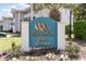Attractive Spinnaker Cove community sign with lush landscaping at 4409 Eastport Blvd. # E2, Little River, SC 29566