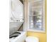 Laundry area featuring stacked washer and dryer, a window providing natural light and ventilation at 4409 Eastport Blvd. # E2, Little River, SC 29566