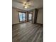 Bedroom with light wood floors, natural light, and a mirrored closet at 4482 Little River Inn Ln. # 2004, Little River, SC 29566