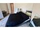 Simple bedroom with gray laminate flooring, bed, and a mirror at 4482 Little River Inn Ln. # 2004, Little River, SC 29566