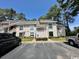 Inviting condo with neutral siding, lush landscaping, and reserved parking spaces at 4482 Little River Inn Ln. # 2004, Little River, SC 29566
