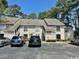 Inviting condo with neutral siding, lush landscaping, and reserved parking spaces at 4482 Little River Inn Ln. # 2004, Little River, SC 29566