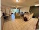 Bright living room with a view of the lanai, tile floors, and open design at 4482 Little River Inn Ln. # 2004, Little River, SC 29566