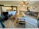 Bright living room with laminate flooring, modern ceiling fan, and seating area at 4482 Little River Inn Ln. # 2004, Little River, SC 29566