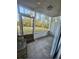 A cozy screened-in porch with views of the backyard, perfect for relaxing and enjoying the outdoors at 4482 Little River Inn Ln. # 2004, Little River, SC 29566