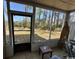 Enclosed sun room with an outdoor view, tile floors and screened windows, inviting the outdoors in at 4482 Little River Inn Ln. # 2004, Little River, SC 29566