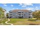 Attractive multi-story condo building with well-manicured lawn, offering desirable community living at 4679 Wild Iris Dr. # 103, Myrtle Beach, SC 29577