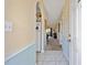 Inviting hallway with tile flooring, archway, and view into the living area at 4679 Wild Iris Dr. # 103, Myrtle Beach, SC 29577