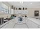 Bright kitchen featuring white cabinets, appliances, and ample counter space at 4679 Wild Iris Dr. # 103, Myrtle Beach, SC 29577