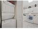 Stacked laundry unit conveniently located near the kitchen, showcasing efficient use of space at 4679 Wild Iris Dr. # 103, Myrtle Beach, SC 29577