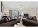 Spacious living area with a ceiling fan and a sliding glass door to the patio at 4679 Wild Iris Dr. # 103, Myrtle Beach, SC 29577