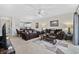 Inviting living room featuring dual sofas, a ceiling fan, and seamless transition to the dining and kitchen areas at 4679 Wild Iris Dr. # 103, Myrtle Beach, SC 29577
