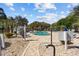 Community pool surrounded by lounge chairs and lush landscaping, perfect for relaxation and recreation at 4679 Wild Iris Dr. # 103, Myrtle Beach, SC 29577