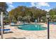 Well-maintained community pool with clear blue water, surrounded by ample seating and lush greenery at 4679 Wild Iris Dr. # 103, Myrtle Beach, SC 29577