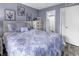 Well lit bedroom with coastal themed decor, neutral wood floors, and ensuite bathroom access at 5905 South Kings Hwy. # 4202, Myrtle Beach, SC 29575