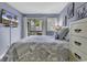 Comfortable bedroom with balcony access, dresser, and coastal-themed decor and TV at 5905 South Kings Hwy. # 4202, Myrtle Beach, SC 29575