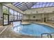 Indoor pool with a glass ceiling and large windows for natural light and an exterior view at 5905 South Kings Hwy. # 4202, Myrtle Beach, SC 29575