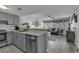 Open-concept living area with stylish furnishings, wood-look flooring, and a view to the adjacent kitchen at 5905 South Kings Hwy. # 4202, Myrtle Beach, SC 29575
