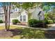Charming townhome with a manicured lawn and stone accents surrounding the foundation at 6095 Catalina Dr. # 616, North Myrtle Beach, SC 29582