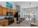 Kitchen features granite counters, stainless appliances, wood cabinetry, and a breakfast nook at 6095 Catalina Dr. # 616, North Myrtle Beach, SC 29582