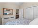 Comfortable bedroom featuring neutral walls, wood floors, and a white dresser at 621 Banks Dr. # 12-1, Myrtle Beach, SC 29588