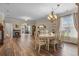 Formal dining room featuring wood floors, elegant chandelier and fireplace at 621 Banks Dr. # 12-1, Myrtle Beach, SC 29588