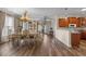 Open dining room with adjacent kitchen featuring hardwood flooring and an elegant chandelier at 621 Banks Dr. # 12-1, Myrtle Beach, SC 29588
