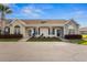 Inviting single-story home featuring neutral siding, stone accents, charming front porch, and well-maintained landscaping at 621 Banks Dr. # 12-1, Myrtle Beach, SC 29588