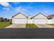 Detached two-car garage with a paved driveway and well-maintained landscaping for added curb appeal at 621 Banks Dr. # 12-1, Myrtle Beach, SC 29588