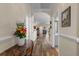 Inviting hallway featuring hard wood floors and views of the living area with fireplace at 621 Banks Dr. # 12-1, Myrtle Beach, SC 29588