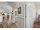 Open hallway view with hardwood floors, neutral paint, white trim, and arched doorways at 621 Banks Dr. # 12-1, Myrtle Beach, SC 29588