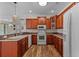 Kitchen area features cherry cabinets, white appliances, and plenty of counter space at 621 Banks Dr. # 12-1, Myrtle Beach, SC 29588