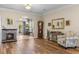 Living room featuring wood floors, a stone fireplace, and an elegant chair at 621 Banks Dr. # 12-1, Myrtle Beach, SC 29588