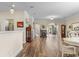 Open-concept living room with hardwood floors, neutral walls, stone fireplace and recessed lighting at 621 Banks Dr. # 12-1, Myrtle Beach, SC 29588