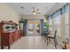 Cozy sun room features tiled floor, lots of windows, a ceiling fan, and backyard access at 621 Banks Dr. # 12-1, Myrtle Beach, SC 29588